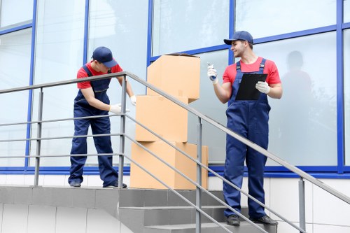 Removal team handling boxes during a Wandsworth home move