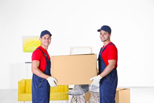 Removal team preparing a safe move with equipment and protective packing materials