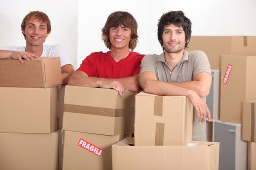 Movers handling furniture in a Wandsworth flat