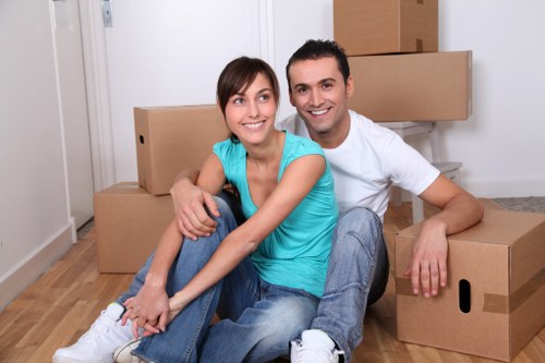 Helper carrying household items during a Wandsworth relocation