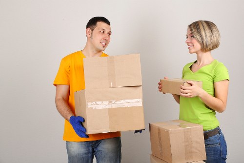 Local furniture collection service loading office desks and chairs