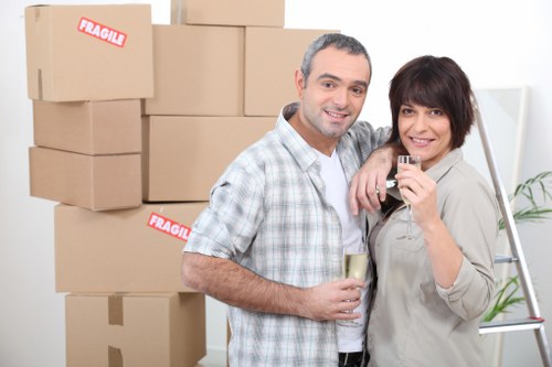 Careful unpacking of household items in a Wandsworth apartment